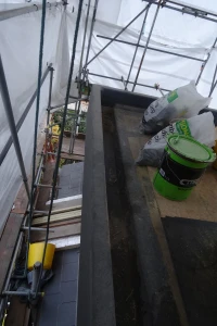Concealed dormer gutter