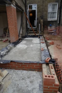 Side-infill extension slab