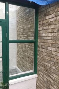 New party wall to neighbouring conservatory